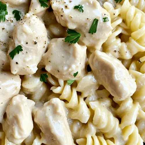 If you’re searching for a comfort food recipe that encapsulates the essence of home-cooked goodness, look no further than Creamy Garlic Butter Chicken & Rotini in Parmesan Sauce. This delightful dish combines tender, succulent chicken with perfectly cooked rotini pasta, all enveloped in a rich and flavorful cream sauce that boasts the robust flavors of garlic and butter. The blend of creamy, garlicky, and buttery notes creates a symphony of taste that is both satisfying and indulgent, making it a perfect choice for family dinners, special occasions, or even a cozy night in.